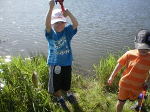 Zach's second catch of the day with Grandpa!